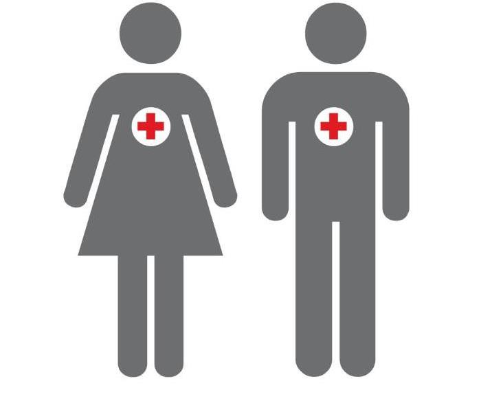 A male and female Volunteer side by side with American Red Cross symbols on them.