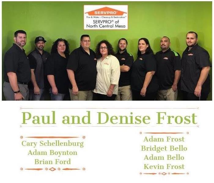 SERVPRO of North Central Mesa's team members in a line surrounding the SERVPRO name
